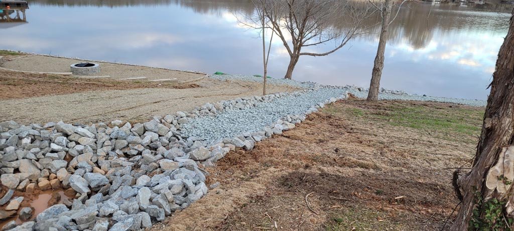 A very clean dry creek bed, slanted for improved drainage.